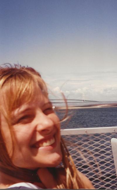 Sharon in front of the Mackinac bridge. Sharon went to Mackinac the summer of 1993. David was supposed to feed her cat. Locked out, he and his brother climbed on the roof and in through Sharon's window. Adam Chiapetta played Simon & Garfunkel at crushingly loud volumes at high school parties.